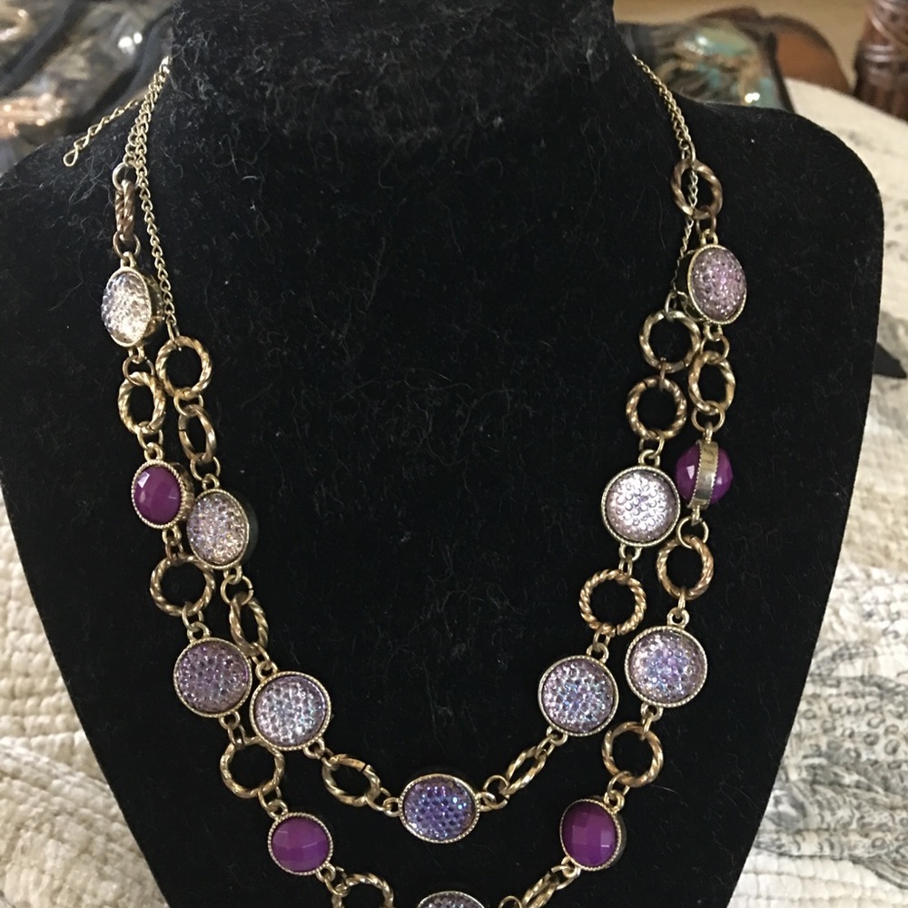 Gold plated necklace with purple stones.